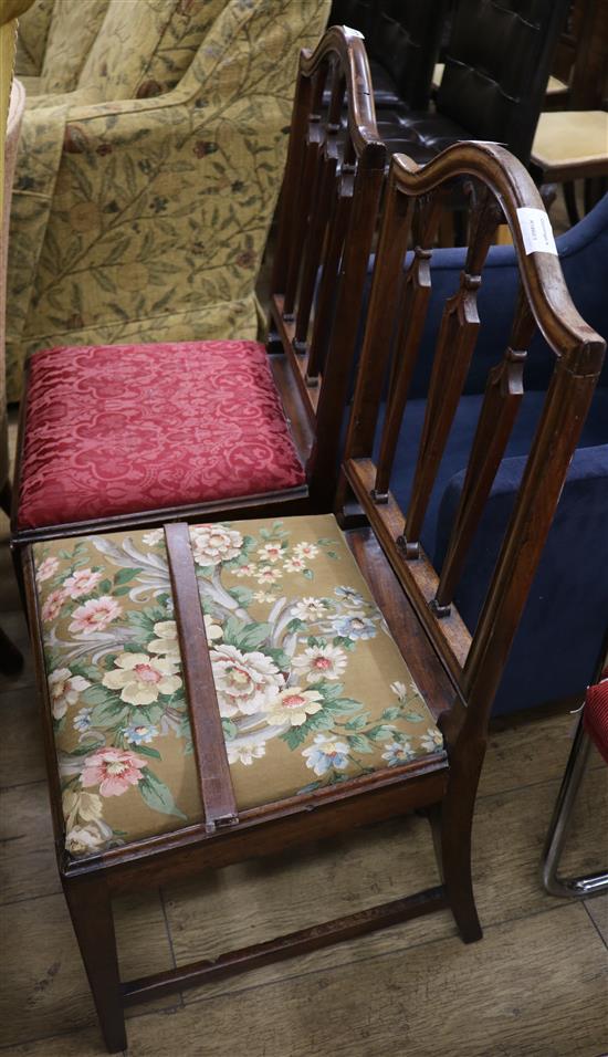 Two George III Hepplewhite style mahogany dining chairs, the spars carved with Prince of Wales plumes
